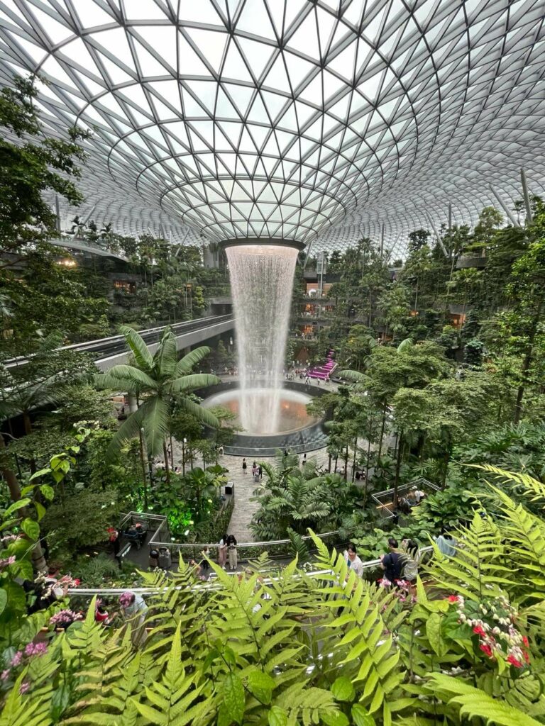 ETFE Singapore: Jewel Changi Airport features 7,390 m² of ETFE drop-off canopies and a 110 m² roof cushion above the Rain Vortex, built for light and durability.