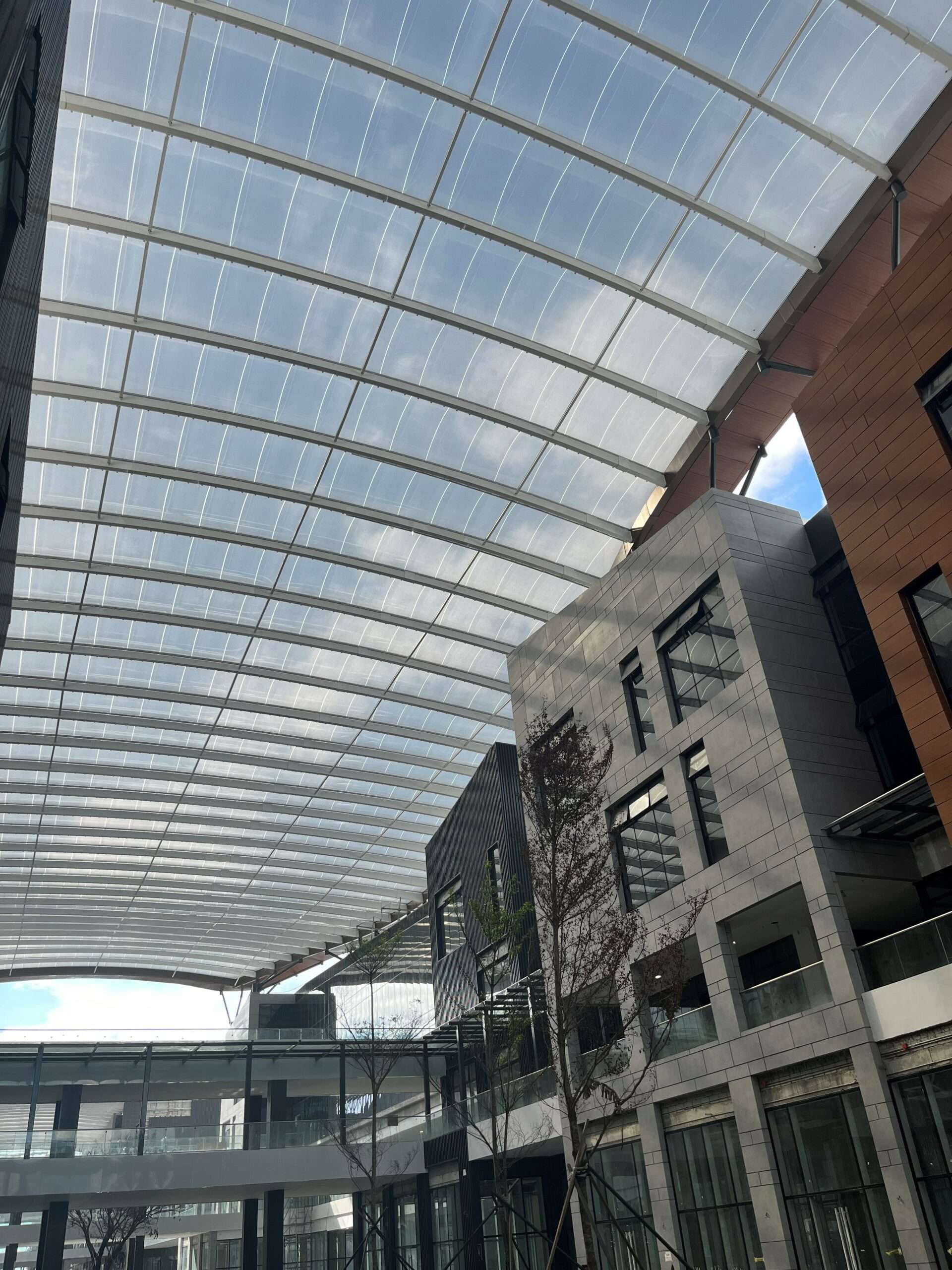 ETFE Philippines: Aseana Parqal features 8,250 m² of elevated ETFE canopies that deliver daylight, shading and low maintenance for Manila’s retail boulevard.