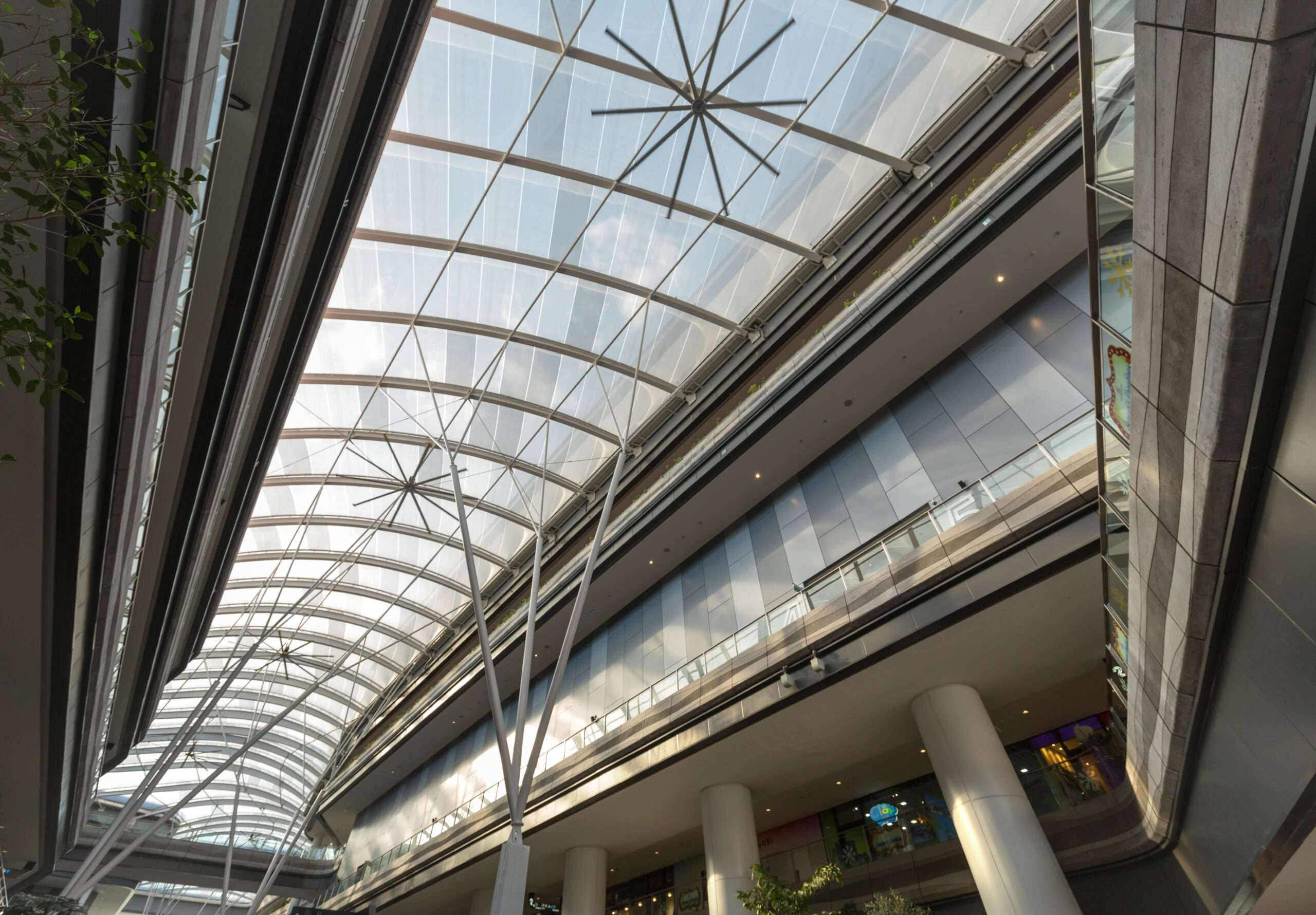 ETFE Singapore: Our Tampines Hub features a 3,600 m² two-layer ETFE canopy with custom print shading, delivering comfort, daylight and community space openness.