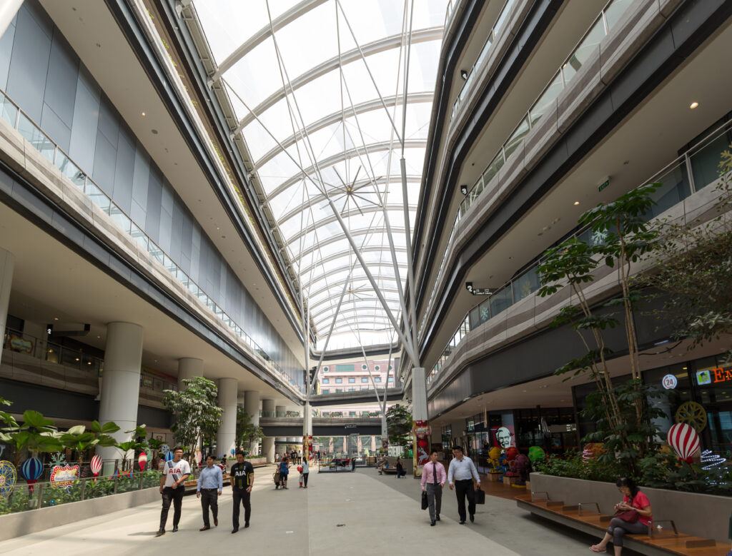 ETFE Singapore: Our Tampines Hub features a 3,600 m² two-layer ETFE canopy with custom print shading, delivering comfort, daylight and community space openness.
