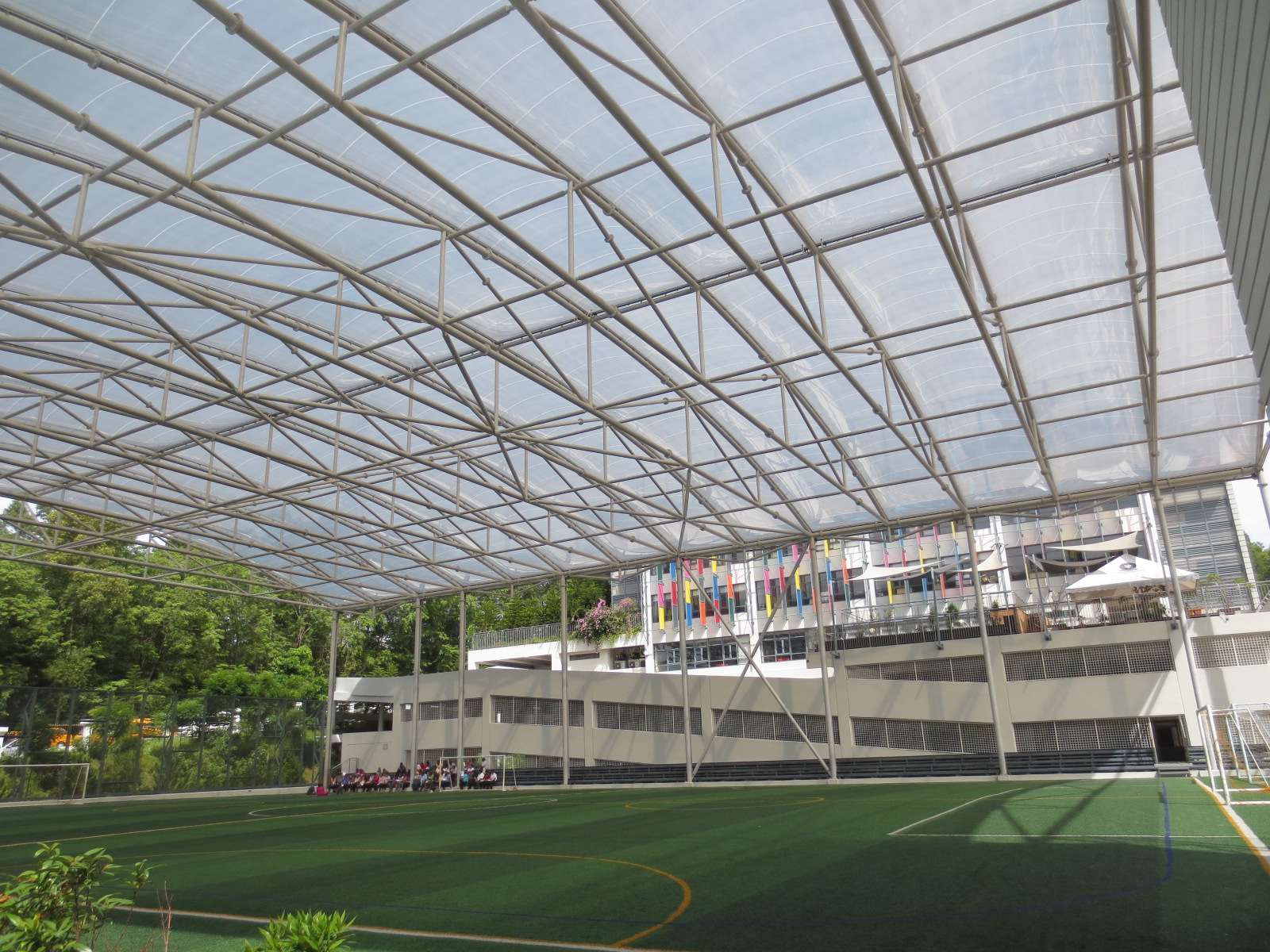ETFE Malaysia: British International School KL features a 2,800 m² ETFE canopy that provides UV protection and all-weather shelter for outdoor play and school events.