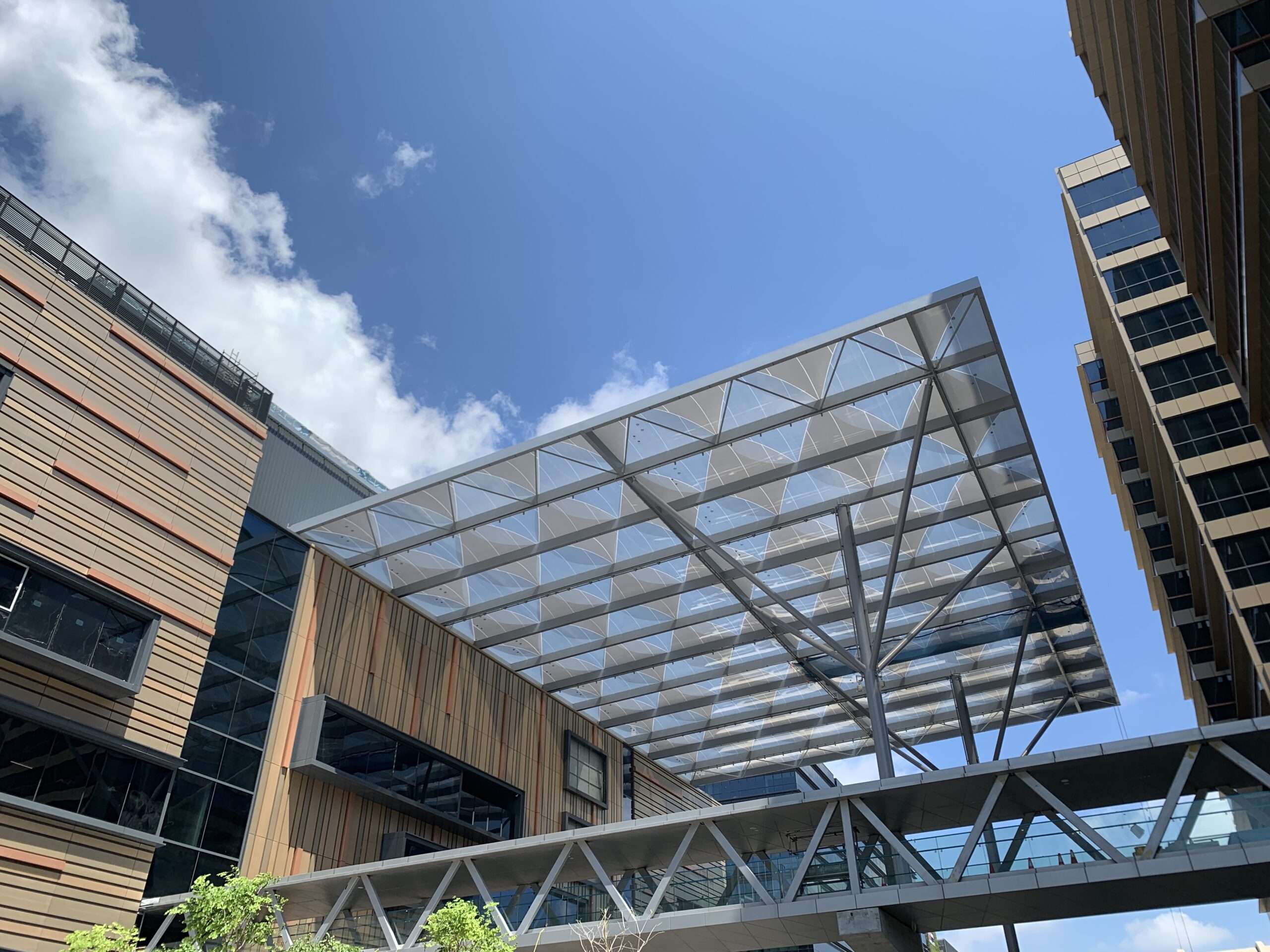 ETFE Singapore: Paya Lebar Quarter features a printed ETFE canopy providing lightweight shade and rain protection for a central public plaza.