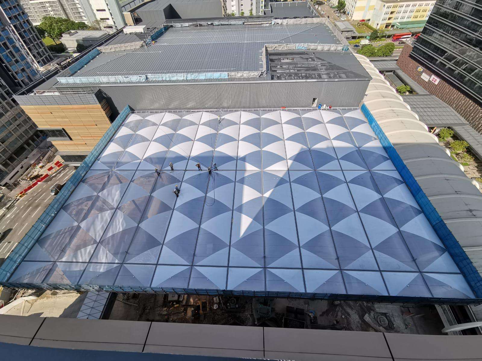 ETFE Singapore: Paya Lebar Quarter features a printed ETFE canopy providing lightweight shade and rain protection for a central public plaza.