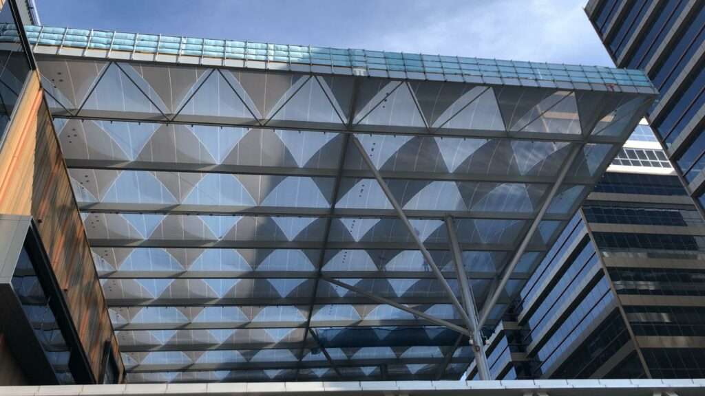 ETFE Singapore: Paya Lebar Quarter features a printed ETFE canopy providing lightweight shade and rain protection for a central public plaza.