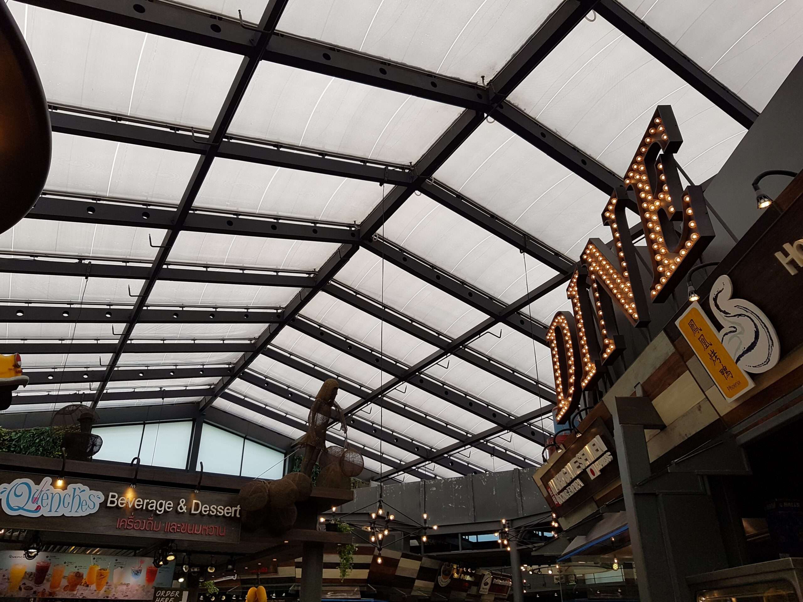 ETFE Thailand: Siam Center Bangkok features a 900 m² three-layer ETFE roof over its food court, delivering natural daylight, acoustic comfort and lightweight performance.