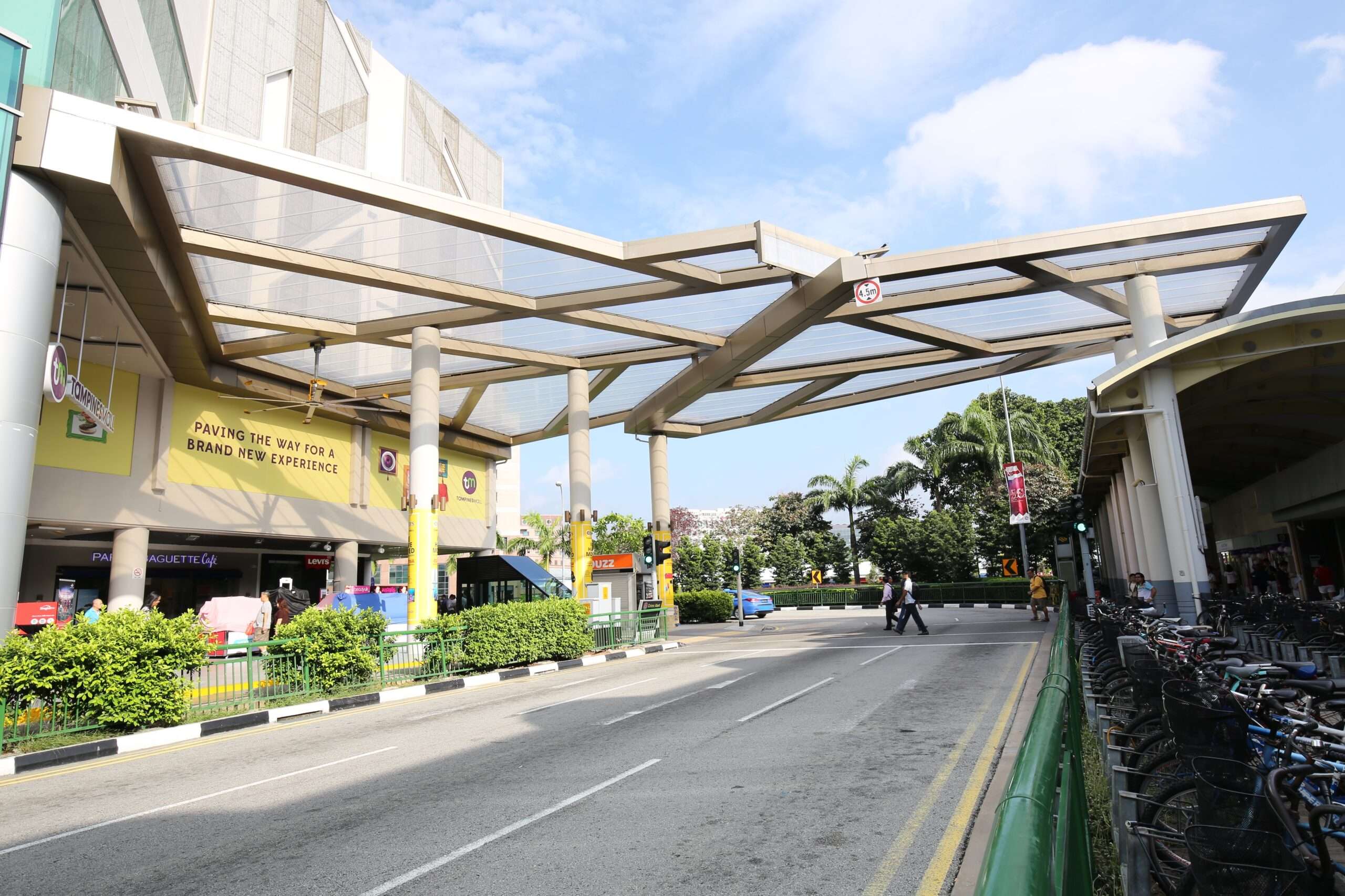 Tampines Mall features a 440 m² single-layer ETFE canopy linking the mall to the MRT station, providing pedestrians shade and rain protection.