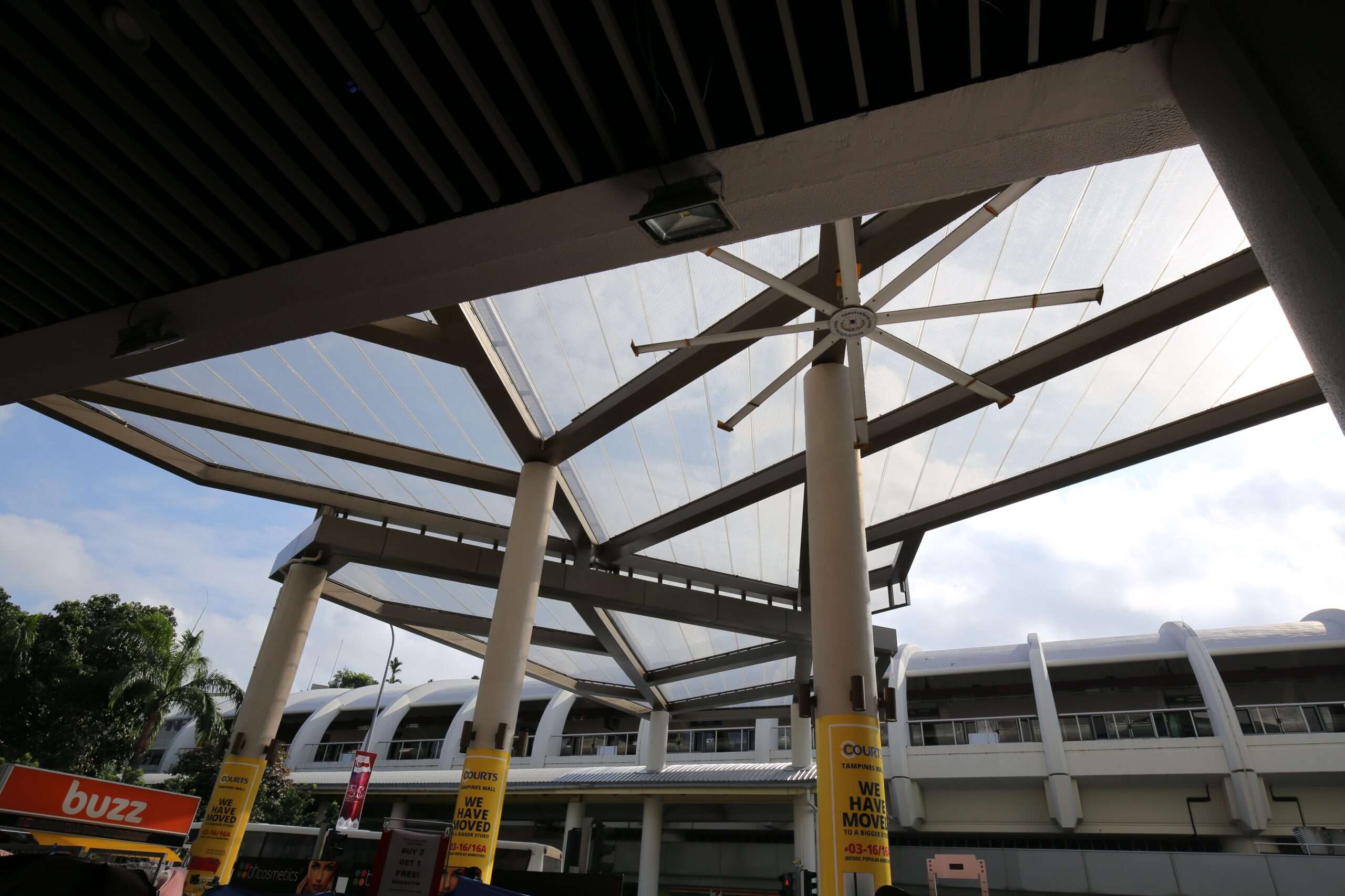 Tampines Mall features a 440 m² single-layer ETFE canopy linking the mall to the MRT station, providing pedestrians shade and rain protection.