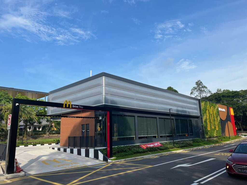 ETFE Singapore: McDonald’s at Choa Chu Kang Park features a lightweight ETFE facade providing shade and rain protection for an open park pavilion.