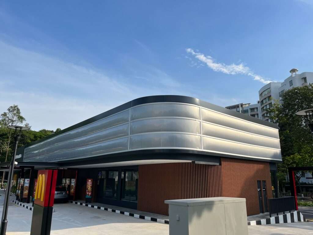 ETFE Singapore: McDonald’s at Choa Chu Kang Park features a lightweight ETFE facade providing shade and rain protection for an open park pavilion.
